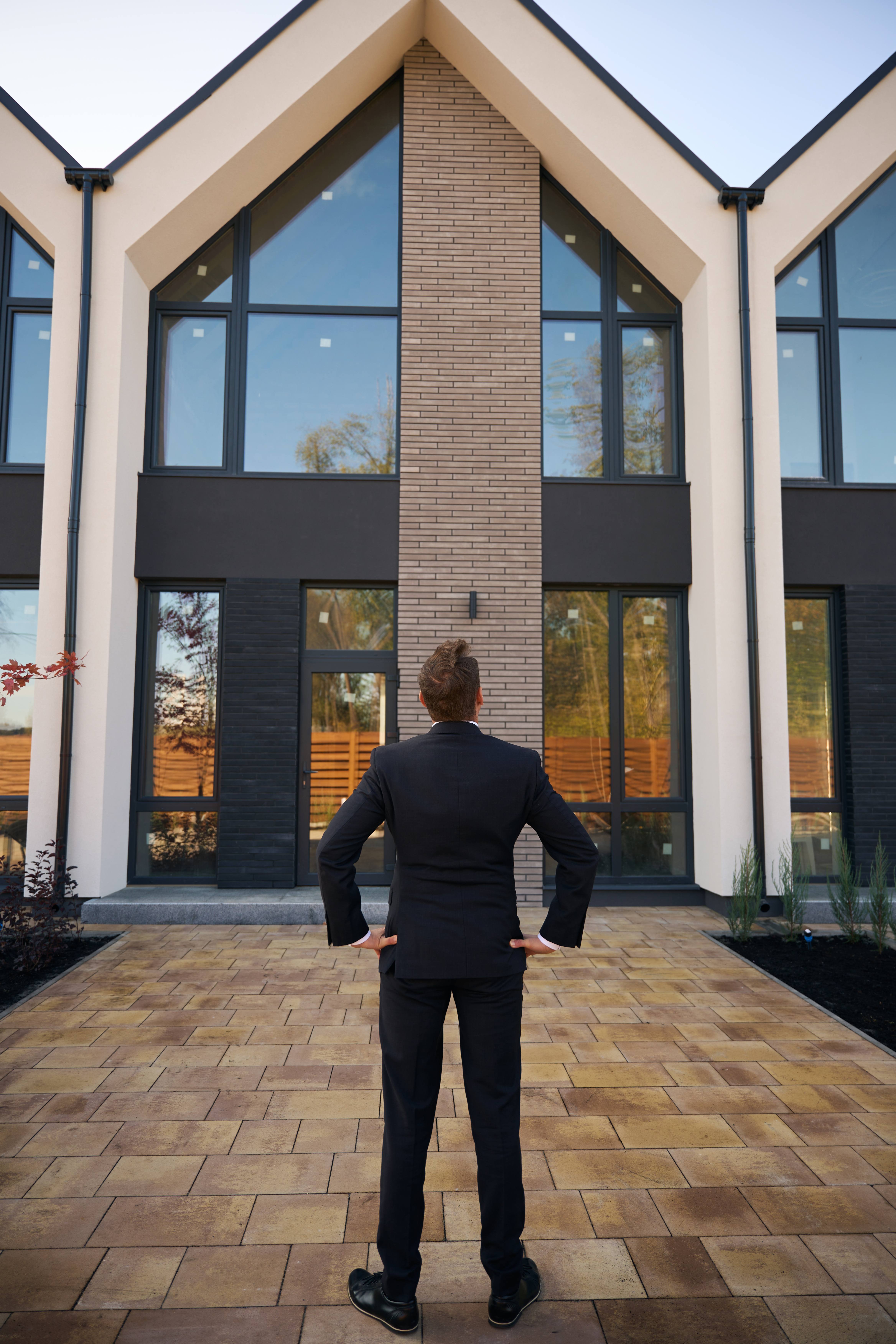 back-view-photo-of-man-standing-in-front-of-buildi-2024-10-22-14-08-53-utc-2